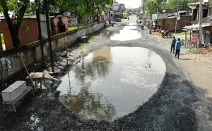 Potholes of the size of small ponds. Image Source NDTV